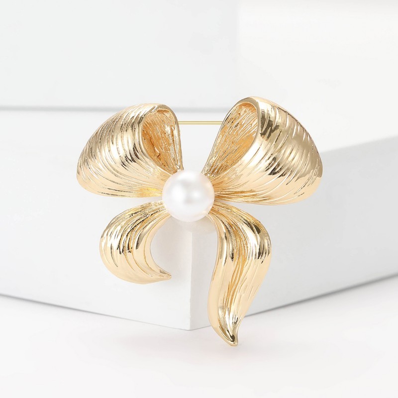 Broche épingle noeud élégant vintage en perles JOSSLYN Broche épingle noeud élégant vintage en perles JOSSLYN